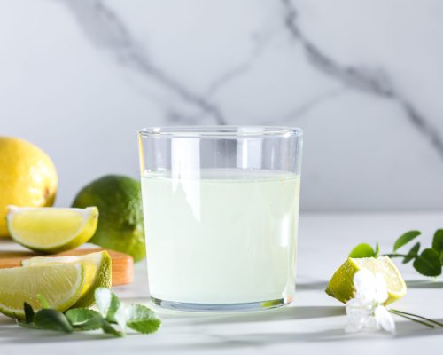 drinks-with-lemon-and-lime-shot-on-reflective-whit-2025-03-25-05-08-15-utc