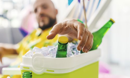 man-taking-a-cold-beer-from-a-cooler-box-2025-01-09-18-38-29-utc